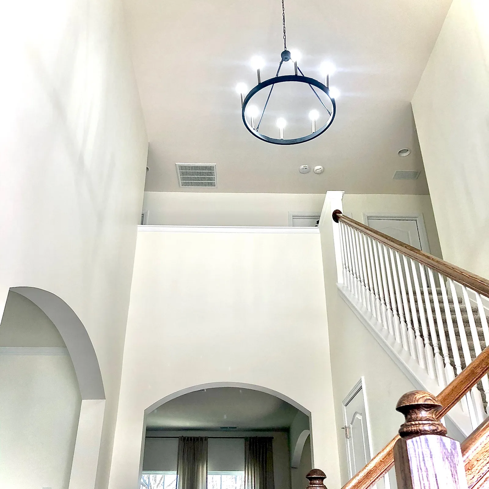 Stairway chandelier installation